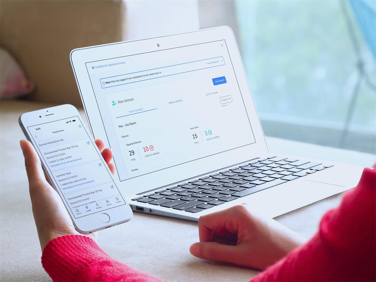 A customer uses the Embleema app on their phone and laptop.